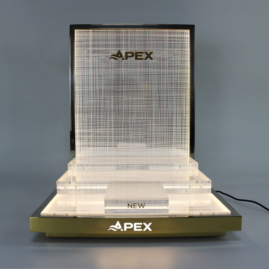 Warm LED Lighted Tiered Lucite Merchandise Display Pedestal, Gold Stainless Steel Frame Woven Textured Backboard Custom Brand Logo Offline Boutique Shooting Prop Bulk Supply